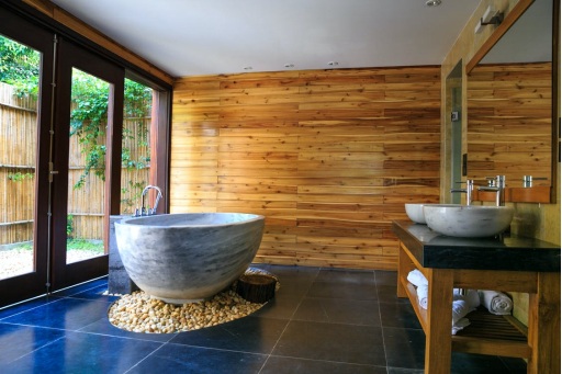 A freestanding bathtub design installed in a bathroom