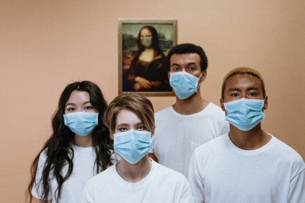 Four people wearing masks